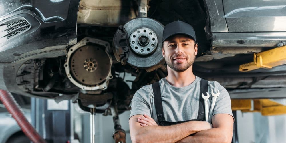 Mechanic replacing the tires on a car.